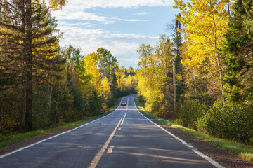 Curve in the Gunflint Trail in northern Minnesota at sunset during autumn
