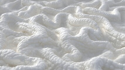A close-up view of white fabric or fluffy material with wavy, abstract folds. The soft clean texture providing a pure and minimal background design.