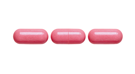 Three pink oval capsules in a horizontal row against a black background