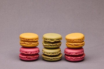 Four macarons stacked pairs on gray background