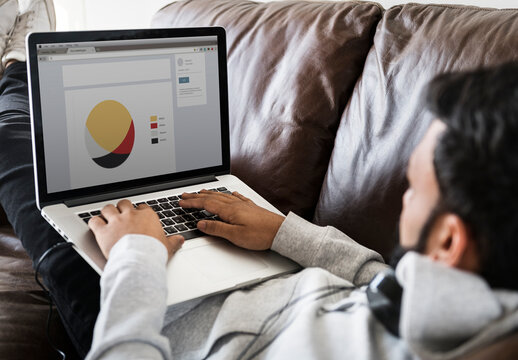 Man Using Laptop Mockup On Sofa
