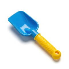 Bright blue plastic beach shovel with yellow handle for sand play