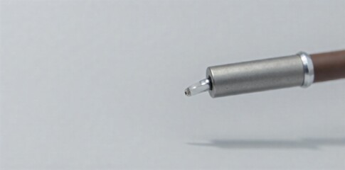 Naklejka premium Stethoscope Head and Tubing, Macro View, Texture and Detail Focus Extreme macro shot of the head and part of the tubing of a doctor s stethoscope. Focus on the fine details of the metal and rubber