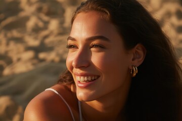 Young woman with radiant smile bathed in golden hour sunlight outdoors
