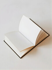 Open book or journal with blank page placed on a plain white surface, its page slightly turned. Ready to be filled with new thoughts and stories
