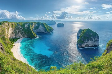 Sunny tropical coastline with turquoise clear waters, white sandy beach, lush green cliffs, and distinct rock formations emerging from the ocean under a bright blue sky with scattered clouds