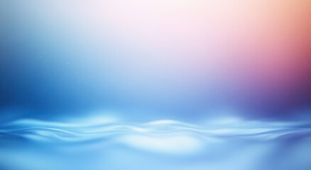 Fototapeta premium Soft gradient background blending serene blue tones with light pink and peach hues above gentle, undulating water surface creating a calm and peaceful atmosphere