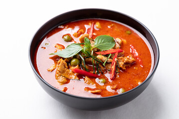 Thai food, Red curry with pork in black bowl on white background