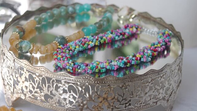 Colorful handmade bead bracelets on display in a bright shop