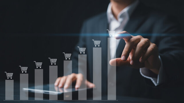 Man in suit interacting with shopping cart bar graph representing sales growth and online business success