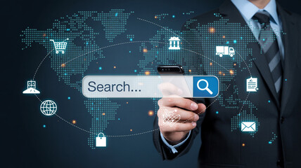 A suited man holding a search bar with world map and icons representing global online business network