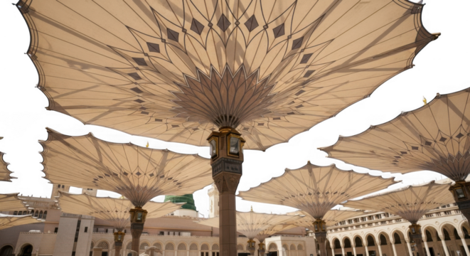 Large beige umbrellas providing shade in an outdoor courtyard with architectural columns isolated on transparent background - Powered by Adobe