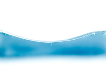 Abstract blue tones of mineral water splash to created wave and bubbles isolated on white background. Copy space.