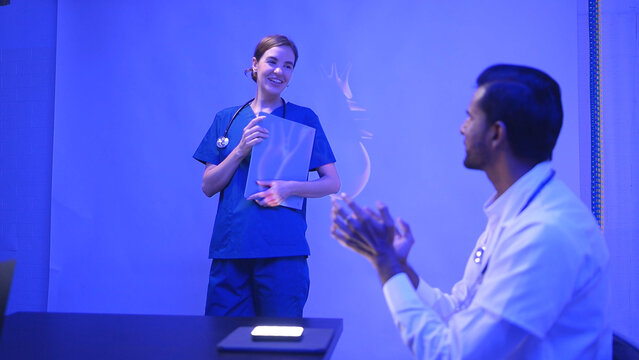 Doctors and medical professionals celebrate successful patient surgery - Powered by Adobe