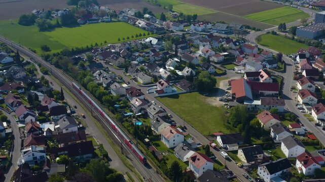Aerial view of a public train driving ina city in Germany ona cloudy spring day