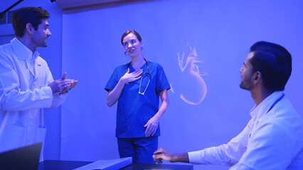 Doctors and medical professionals celebrate successful patient surgery