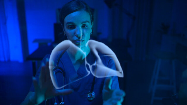 Doctors preparing for lung surgery with futuristic hologram technology