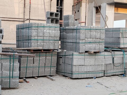 Concrete cement block is rectangular building unit made from mixture of Portland cement, aggregates. Molded and cured to harden solid shape. Block pallet for building or Tabook at Construction site.
