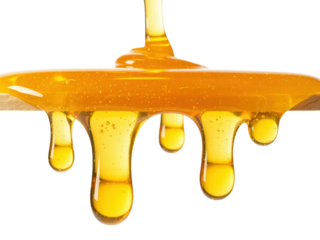 Macro of Golden Honey Drips on White Background