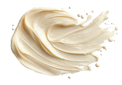 Creamy, light beige substance spread in a swirled, irregular shape