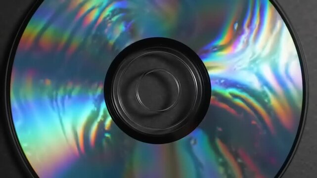 Close up of a holographic disc with vibrant colors and reflective surface