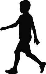 Silhouette of a young boy walking forward in a dynamic pose
