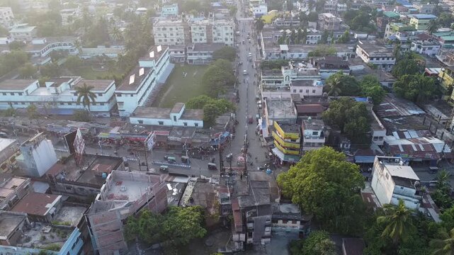birds eye 360  view video clip of vehicles in motion on a roundabout traffic point during early morning time in India