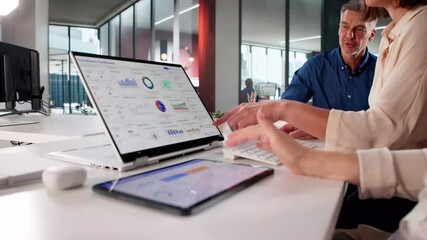 Business People Using Legal Compliance Dashboard - Powered by Adobe