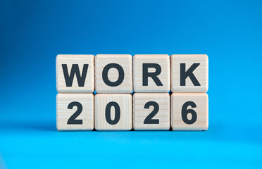 New year Work 2026 concept. Wooden cubes on a blue background