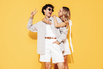 Happy beautiful romantic teenage couple. Smiling handsome caucasian man and young woman in summer...