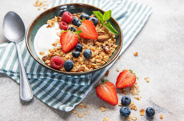 Granola bowl with fresh berries for healthy breakfast