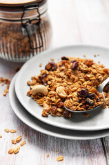 Healthy homemade granola mix on plate with spoon