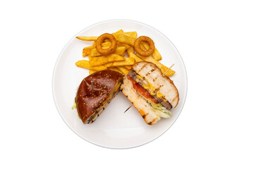 Transparent PNG of a cheeseburger with onion rings and fries on a white plate, isolated for food and menu design.