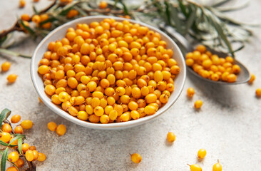 Sea buckthorn berries in bowl healthy eating concept