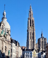 Cathedral of Our Lady's gothic spires and bell tower dominating the skyline, surrounded by traditional urban architecture in Antwerpen, Belgium
