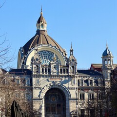 Antwerp Central railway station building facade presenting grand architecture, dome, and historic...