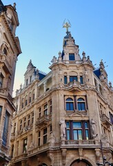Ornate historical architecture on Meir street in central Antwerp, Belgium, featuring sculptures and...