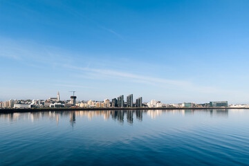 Reykjavik city skyline reflecting in tranquil faxaflói bay