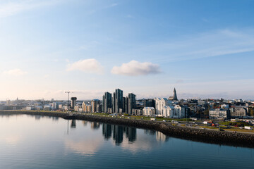 Naklejka premium Reykjavik cityscape with hallgrímskirkja and faxafloi bay