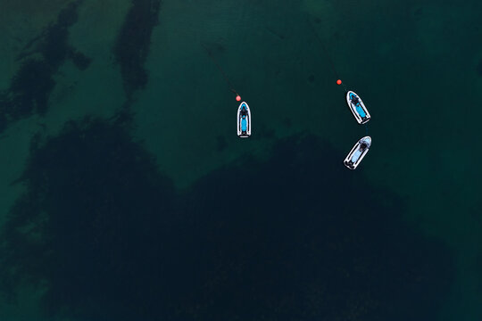 Aerial view of personal watercraft floating on calm water