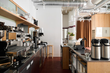 Bright coffee shop interior with modern equipment and seating