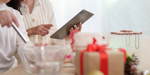 Holiday Baking. Family preparing Christmas cookies together in a cozy kitchen.