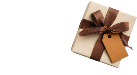 A square box with a brown ribbon and tag on a black background, angled slightly
