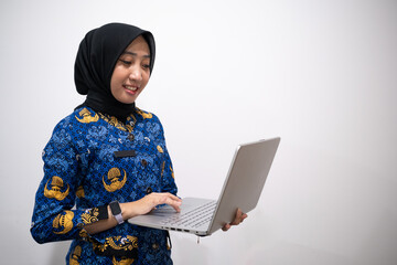 a female dressed in Indonesian Civil Servant uniform or known as KORPRI in isolated white background