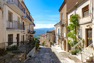 A narrow street among the old houses of Padula, a village in the province of Salerno, Italy.