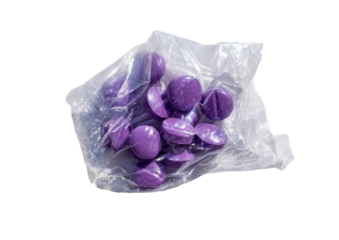 A clear plastic bag contains a heap of purple, circular, scored pills