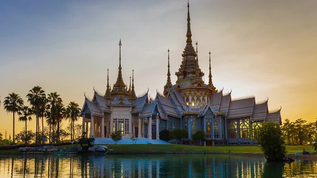 Timelapse of Wat Non Kum or Wat Luang Pho To in Sikhio District, Nakhon Ratchasima, Korat, Thailand is a symbolic place of temples in Thailand. At sunset, there is a reflection in the water.