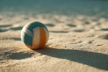 Beach volleyball ball on light sand