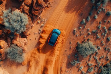 Aerial View SUV Driving on Red Sand Desert Road Dust Trail