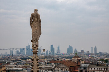 Daytime view of famous Milan Cathedral or Duomo di Milano on piazza in Milan, Italy